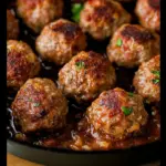 Homemade meatballs served with marinara sauce on a plate