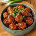 Plate of homemade sweet chili meatballs drizzled with sauce