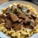 Savory venison tips served over noodles with vegetables in a bowl