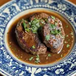 Succulent Venison Steak Diane served with a rich sauce and garnish
