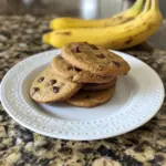 Delicious banana bread cookies on a plate, garnished with banana slices.