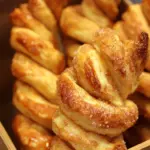 Freshly baked cinnamon sugar twists with a golden brown coating