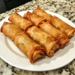Crispy authentic Filipino eggrolls (lumpia) served with dipping sauce.