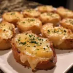 Savory French onion soup bites topped with melted cheese and herbs
