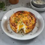 Baked cottage cheese eggs served in a dish, garnished with herbs.