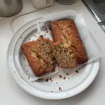 Freshly baked banana bread on a wooden cutting board