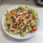 Big Mac Salad served in a bowl with classic toppings and dressing