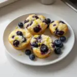 Blueberry and lemon zest cottage cheese bites served on a plate