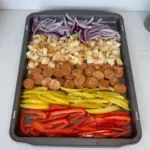 Cajun Inspired Sheet Pan Dinner featuring colorful veggies and spices