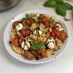 Delicious Caprese Pasta Salad with Balsamic Glaze, featuring fresh tomatoes, mozzarella, and basil.