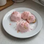 Cherry Blossom Mousse Domes with pink floral decoration and elegant presentation