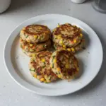 Delicious Chicken Zucchini Corn Burgers served with fresh vegetables