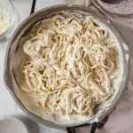 Creamy Cottage Cheese Alfredo sauce served over pasta garnished with parsley.