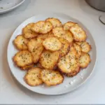 Homemade cottage cheese chips on a rustic wooden table