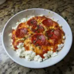 Delicious Cottage Cheese Pizza Bowl topped with fresh vegetables and cheese