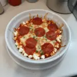 Delicious high protein cottage cheese pizza bowl garnished with fresh ingredients