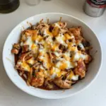 Delicious low carb BBQ chicken bowl with fresh veggies and sauce.