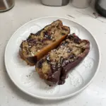 Gluten-free banana bread with cottage cheese and chocolate chips in a loaf pan.