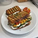 Delicious grilled veggie sandwich with mozzarella cheese and colorful vegetables