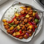 Hawaiian Chicken Sheet Pan with colorful vegetables and pineapple