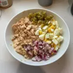 A bowl of healthy tuna egg salad made with fresh ingredients.