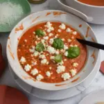 High protein tomato soup garnished with cottage cheese in a bowl