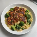 Lemon Pepper Chicken served with Broccoli Orzo on a plate