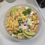 Delicious Mexican street corn pasta salad with fresh ingredients and vibrant colors.