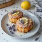Mini lemon cakes with lavender glaze topped with fresh flowers