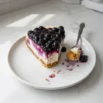 No Bake Blueberry Cheesecake topped with fresh blueberries