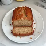 Sliced quick low calorie banana bread on a wooden table
