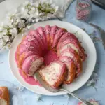 Sakura Essence White Cake topped with delicate cherry blossoms and frosting