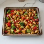 Delicious Sheet Pan Cashew Chicken served with vegetables on a platter.