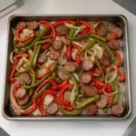 Delicious sheet pan sausage and peppers ready to serve for dinner.