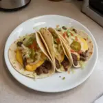 Delicious smash burger tacos served with fresh toppings and condiments.