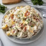 Delicious steakhouse potato salad garnished with herbs and spices