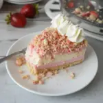 Delicious Strawberry Crunch Cheesecake with a crunchy topping and fresh strawberries