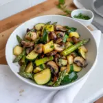 Plate of Asparagus Zucchini and Squash sautéed with herbs
