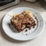 Delicious homemade banana bread brownies topped with chocolate