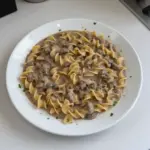 Delicious Beef Stroganoff served with egg noodles and garnished with parsley