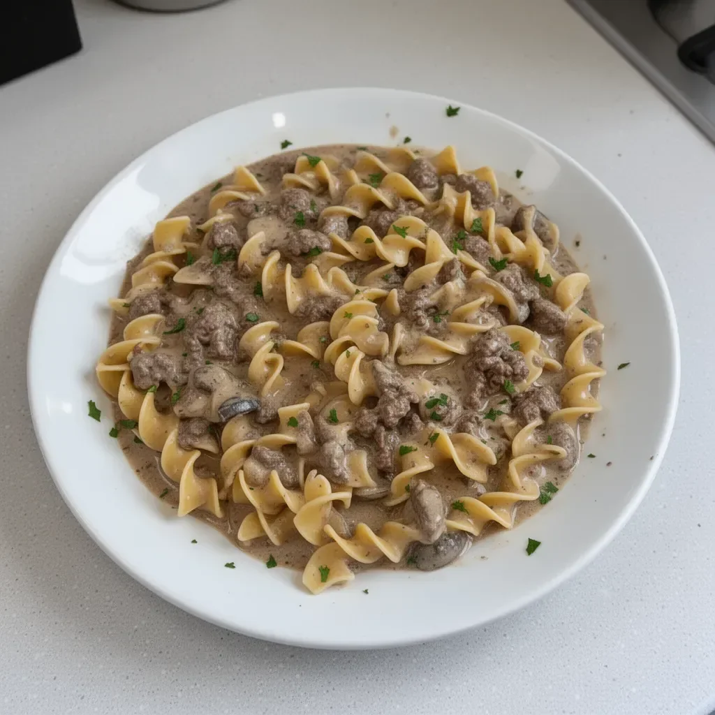 Delicious Beef Stroganoff served with egg noodles and garnished with parsley