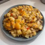 Cheesy ground beef and potato casserole served in a baking dish