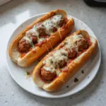 Delicious cheesy meatball subs with melted cheese and savory meatballs on a toasted bun