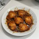 Delicious Chicken Adobo served with rice and vegetables