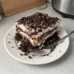 Delicious chocolate lasagna layered with creamy filling and chocolate toppings