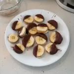 Delicious chocolate peanut butter banana bites on a plate