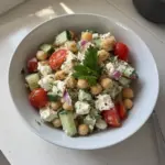 Cottage Cheese and Chickpeas Salad with fresh vegetables in a bowl