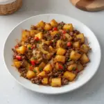 Delicious ground beef potato hash served in a skillet