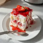 Delicious Heaven on Earth Cake topped with whipped cream and berries