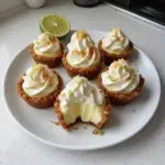 Delicious no-bake mini key lime pies garnished with lime and whipped cream